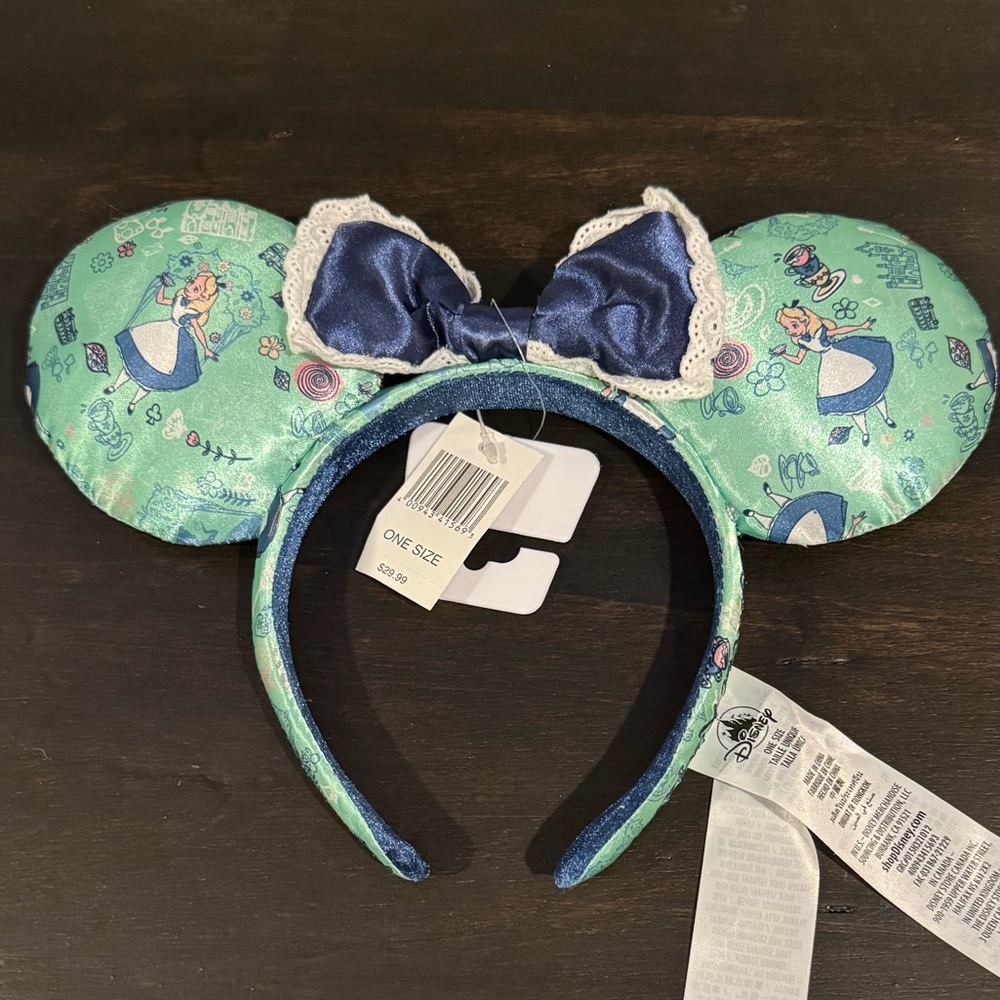 Alice and Wonderland NWT never worn Epcot England Disney ears.